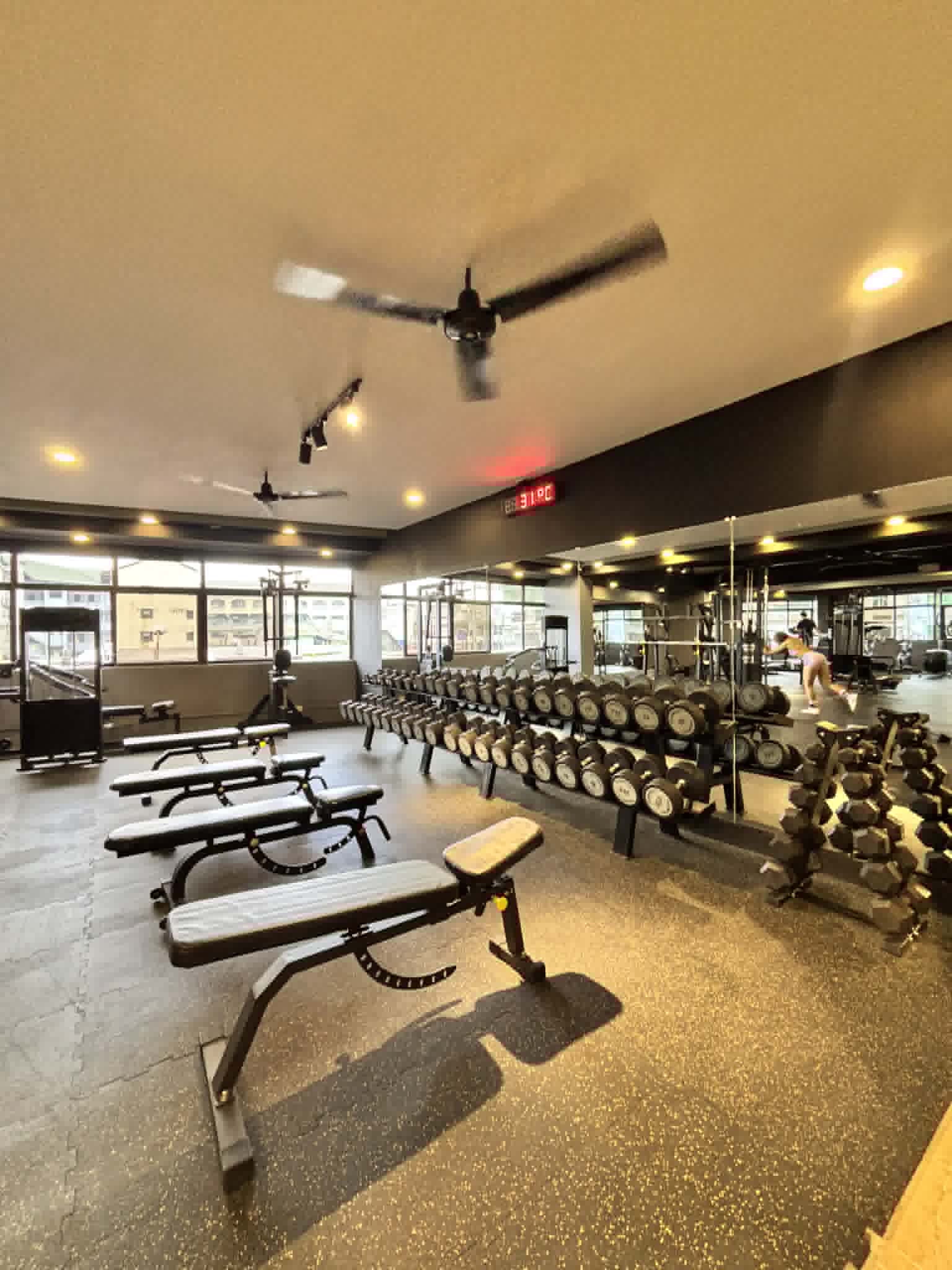 Member using the Flux Fitness app on the gym floor